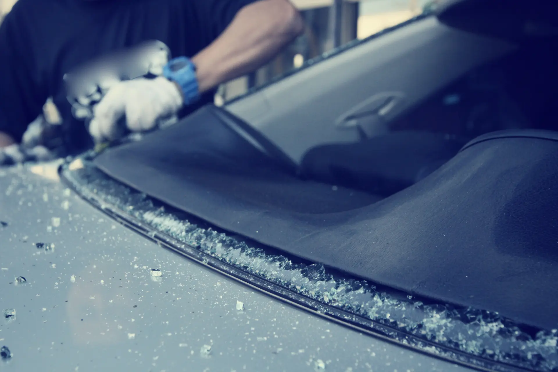 Technician removing a shattered windscreen